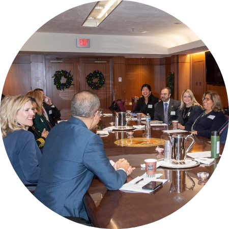 People seated around a table talking