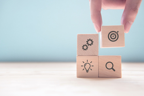 Photo of wooden blocks against a blue background