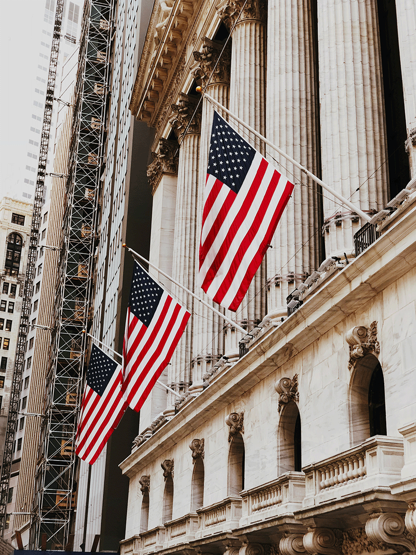 American flag poles on building