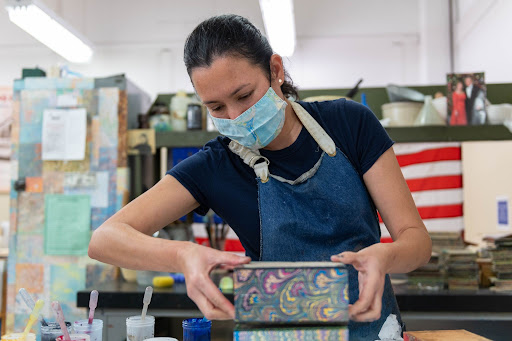 Sarah Hurtt working on a book binding at GPO