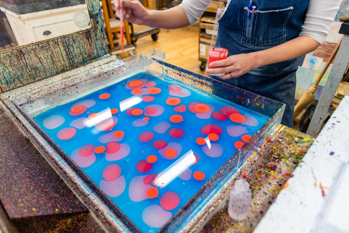 Book marbling solution in tub getting ready for use