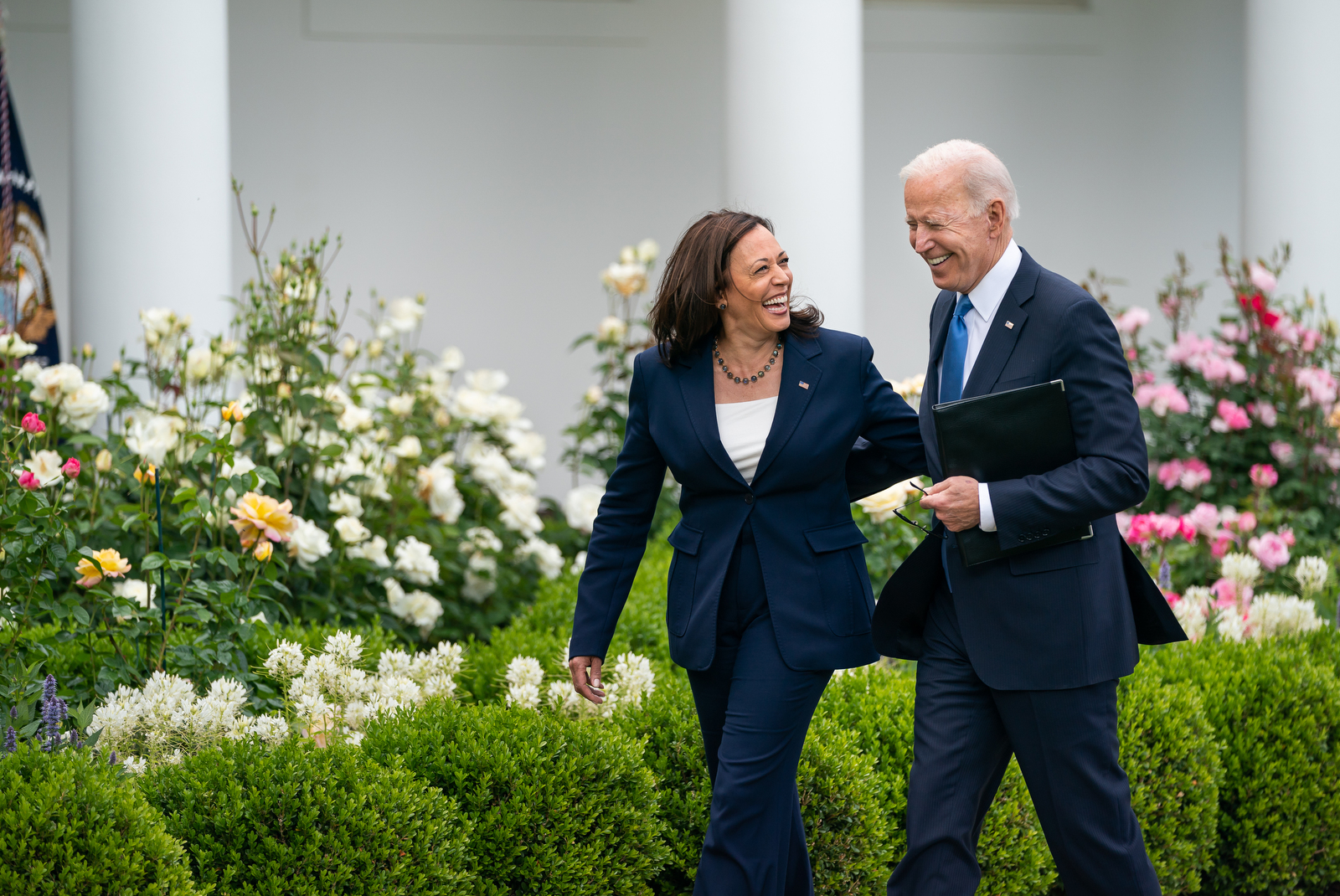 President Joe Biden and Vice President Kamala Harris walk together by the White House.